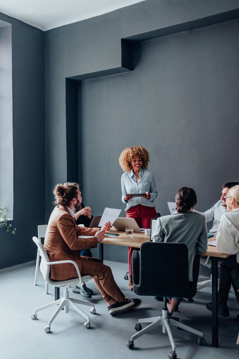 Group of businesspeople in a meeting discussing charity