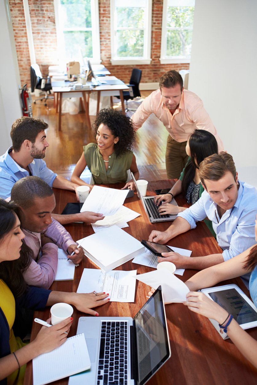 Group of office workers meeting about workplace giving talent engagement