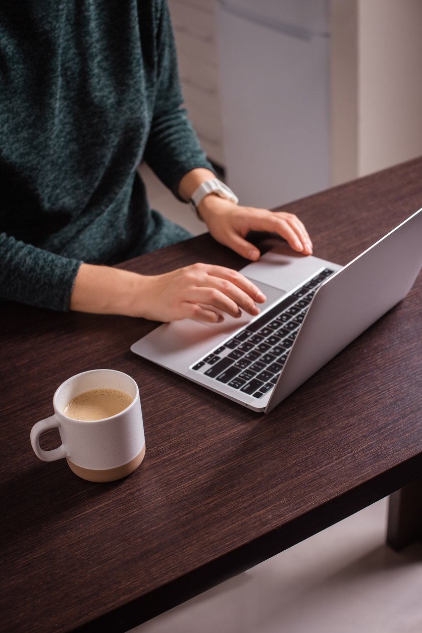 Woman hands typing on laptop work for giving at work